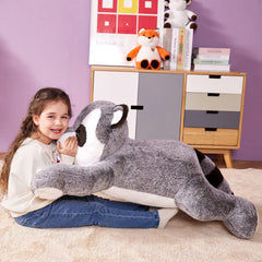 IKASA soft plush raccoon hug pillow for cozy reading moments.