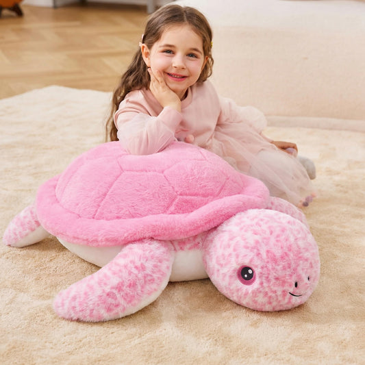 Close-up of IKASA turtle plush shows fluffy fabric and durable stitching.