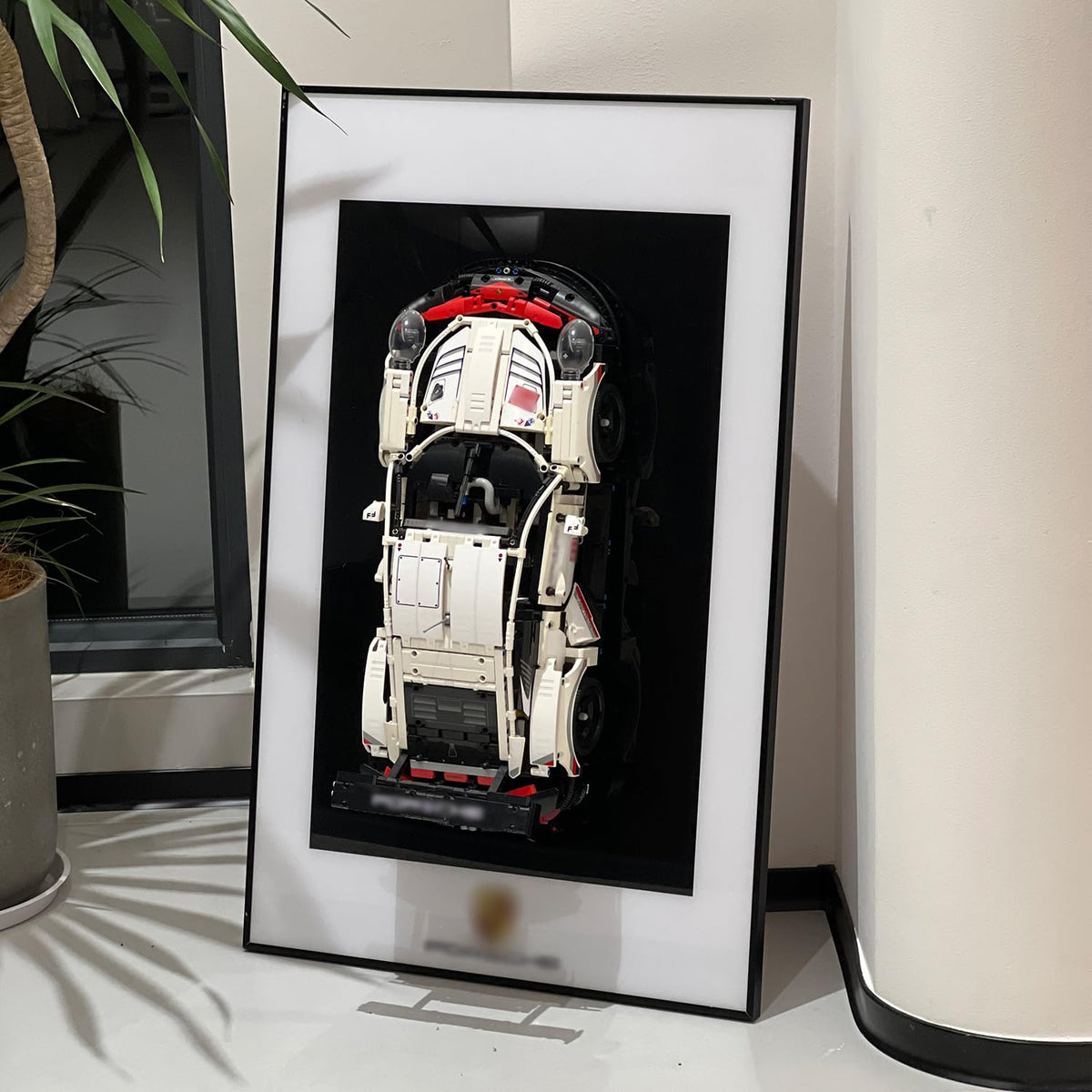 iLuane Display Wallboard frame showcases a sleek, space-saving display for your model car.