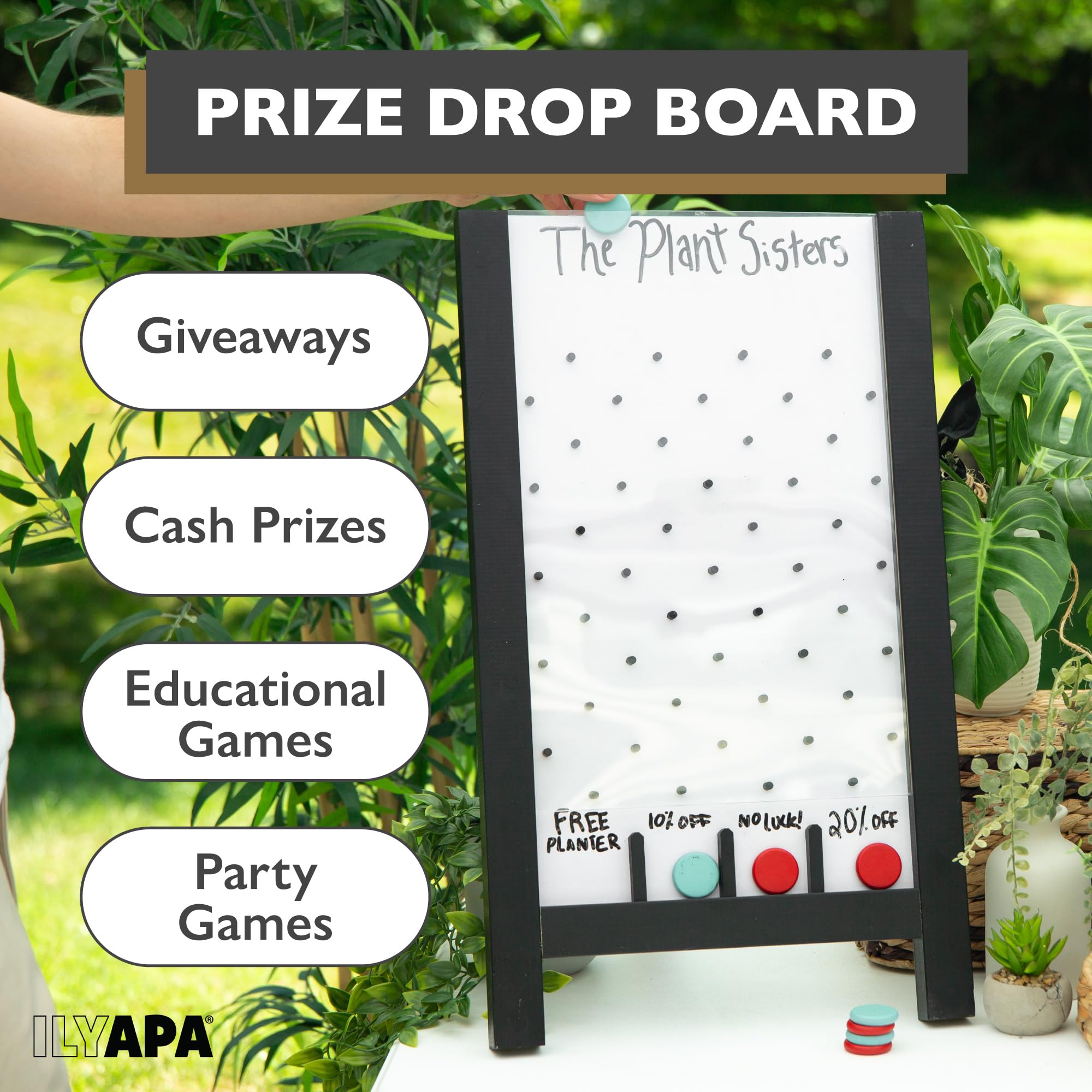 Coins tumble as attendees trigger the prize drop on the Ilyapa board.