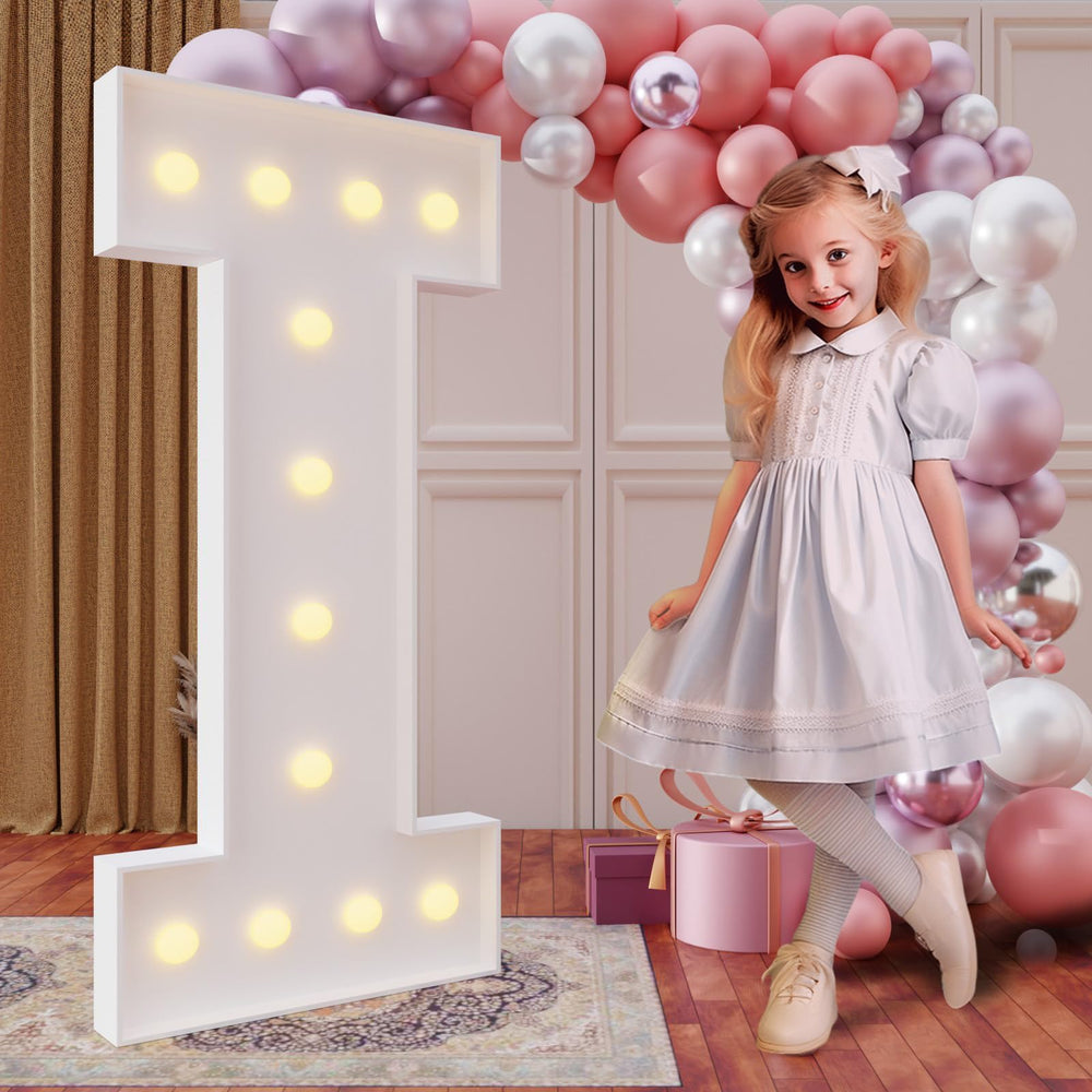 imprsv Letter I marquee glows for birthdays and parties, creating a bold focal point.