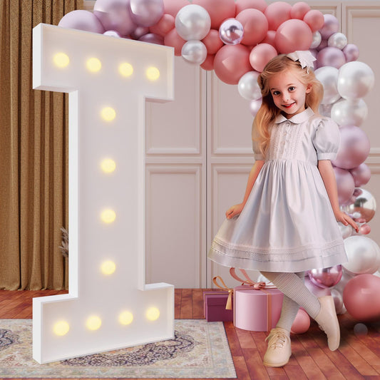imprsv Letter I marquee glows for birthdays and parties, creating a bold focal point.