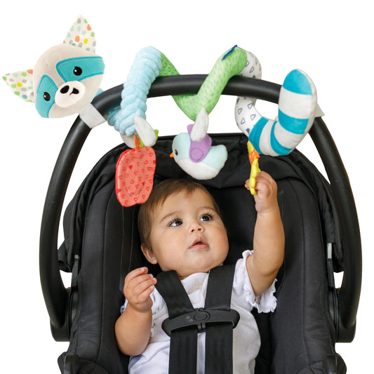 Infantino Spiral Toy wrapped on stroller handle offering bright textures for on-the-go play.