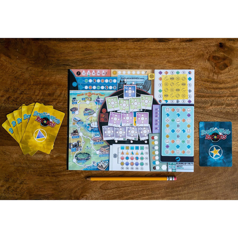 Inside Up Games Draft & Write Records band members components arranged for a creative setup.