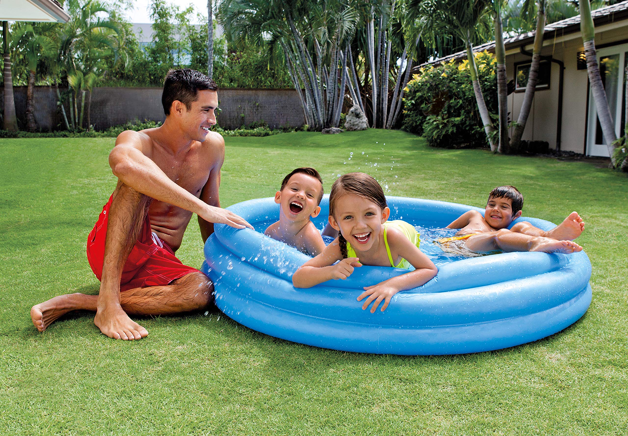 Intex Crystal Blue pool during playtime with kids enjoying water fun in the yard.