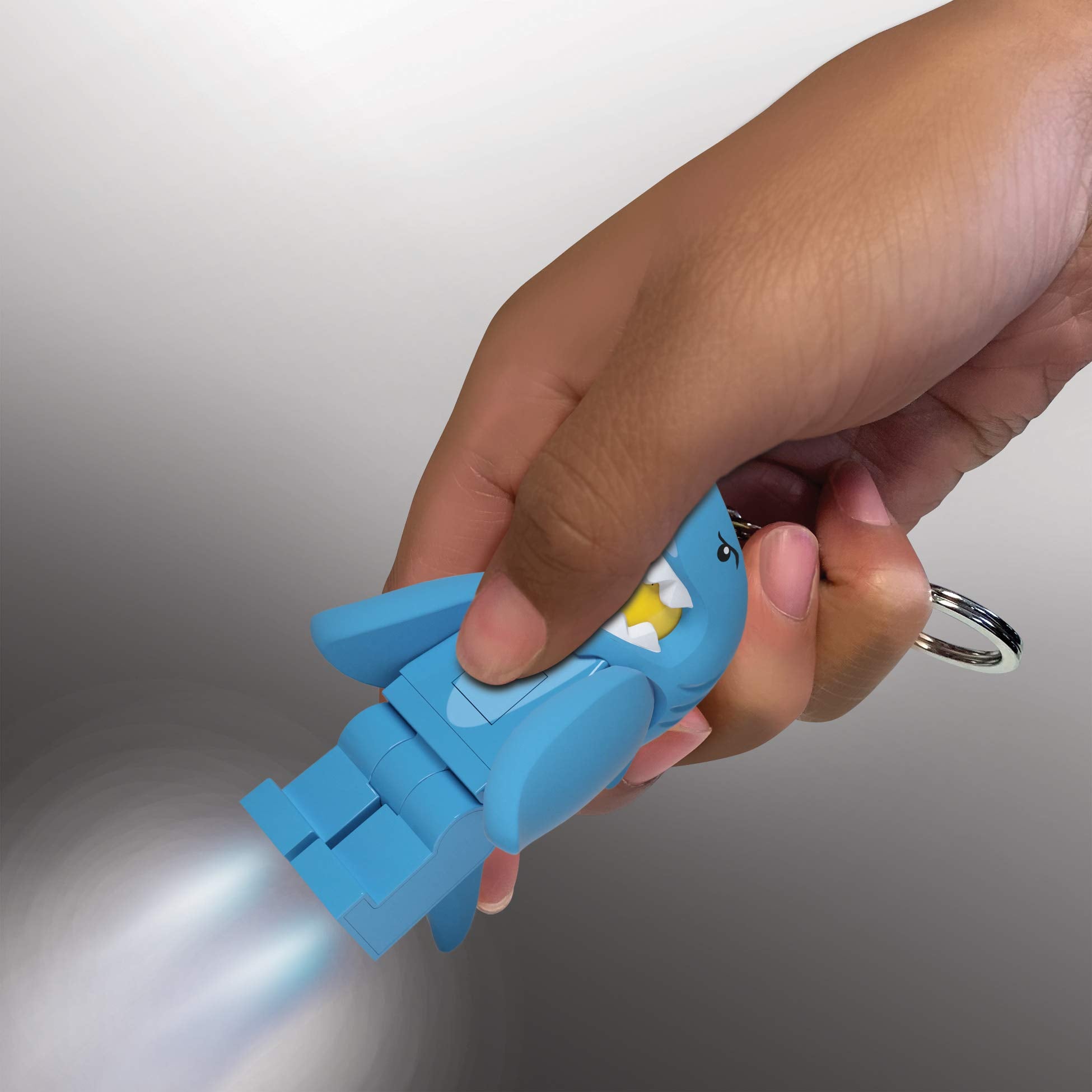IQ LEGO minifigures keychain light with metal key ring for clip-on use.