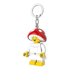 IQ LEGO Mushroom Sprite keychain light as a playful desk companion with a soft glow.
