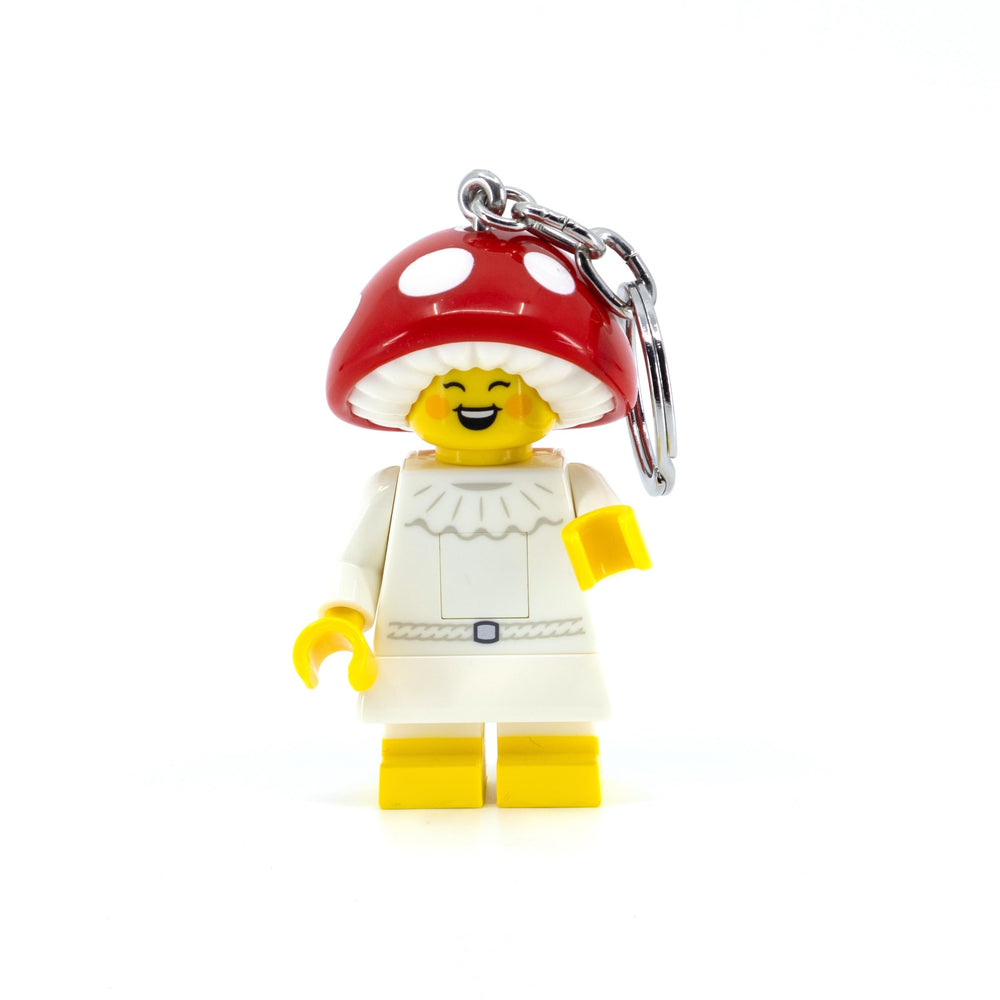 IQ LEGO Mushroom Sprite keychain light with LED feet glow for on-the-go visibility.