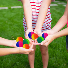 Irrmshr outdoor play ball ready for bounce on grass, concrete, and sidewalks