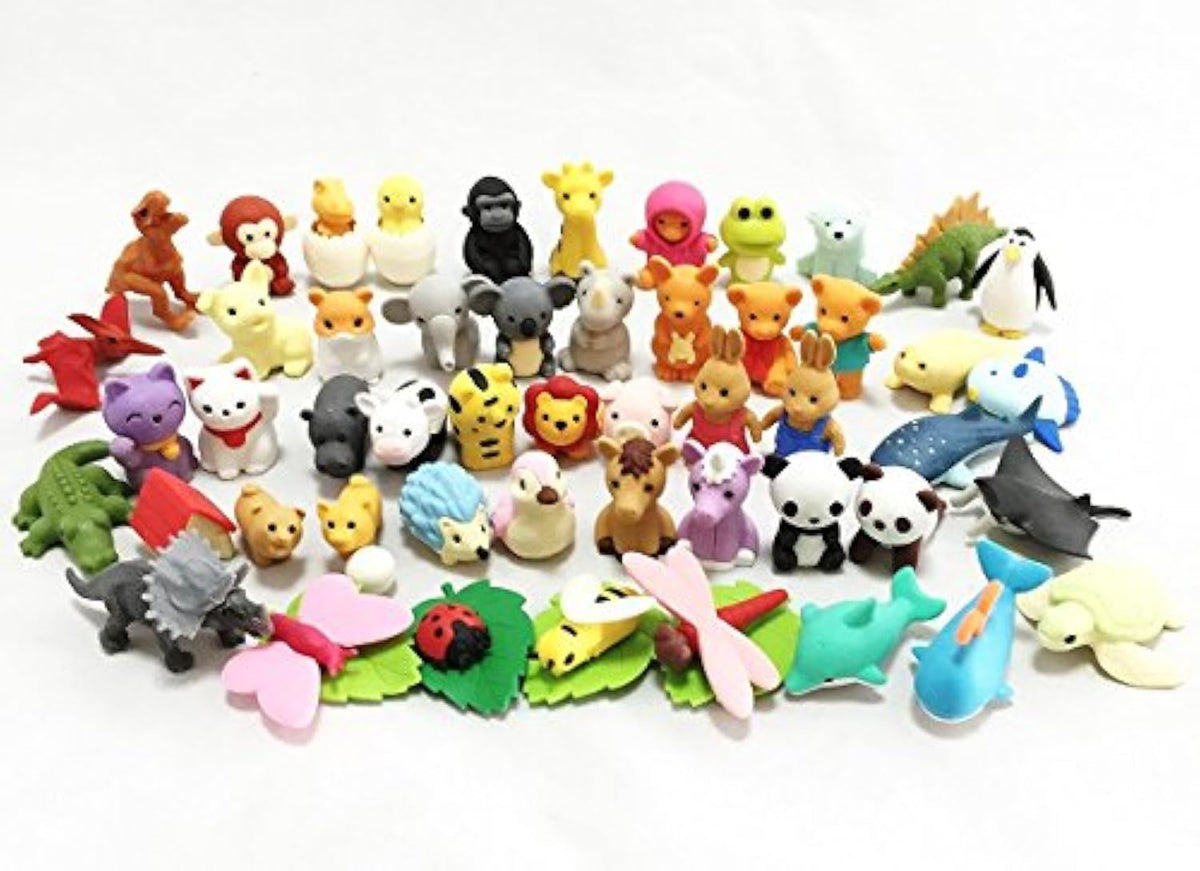 Iwako Animal Collection erasers in bright colors rest on a desk, ideal for classroom tasks.
