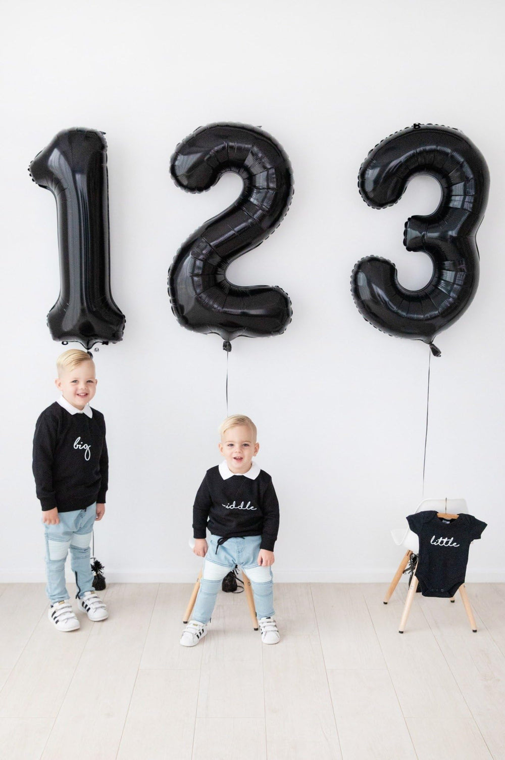 IWERP 100th birthday black foil balloon as a focal point in the party.