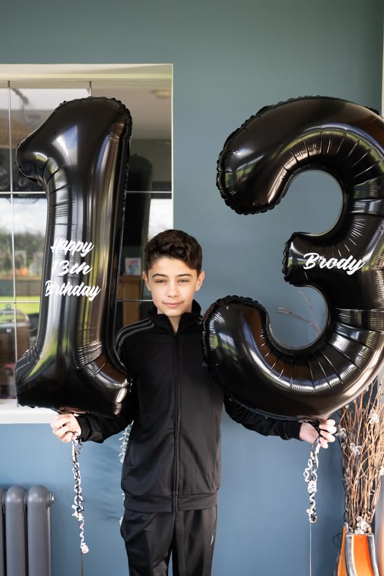 IWERP 13th birthday black foil balloon adds elegant focal point.