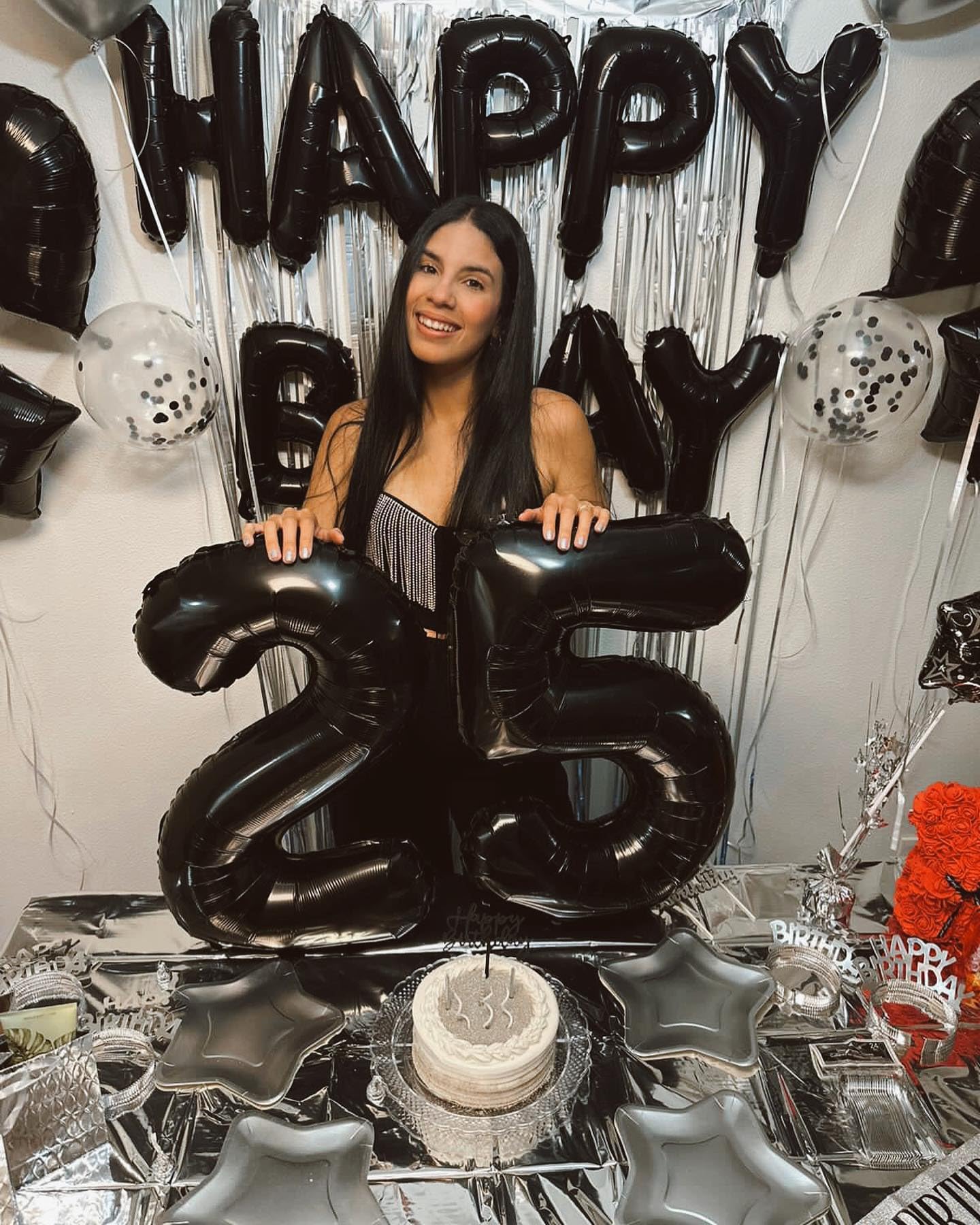 IWERP 15th birthday balloon in black foil enhances party backdrop.