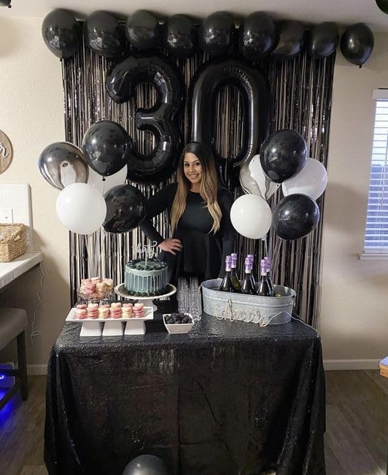 IWERP 8 black number balloon serves as a versatile party prop.