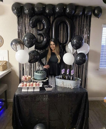 IWERP 8 black number balloon serves as a versatile party prop.
