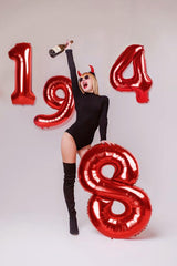 IWERP birthday decor red balloon backdrop enhances party visuals.