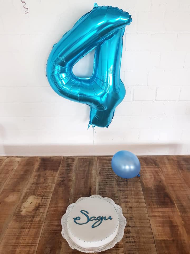 IWERP blue number 4 balloon enhances blue-themed birthday decor.