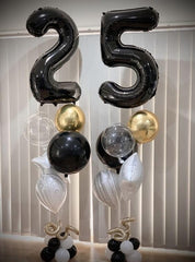 IWERP black 10 balloon on stage backdrop adding elegance.