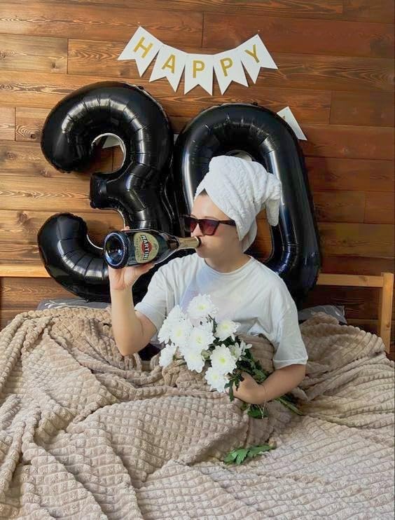 IWERP black 50th anniversary balloon complements black themed party decor.