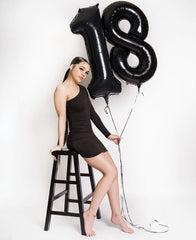 IWERP Elegant black décor elevates cake displays and photo backdrops.