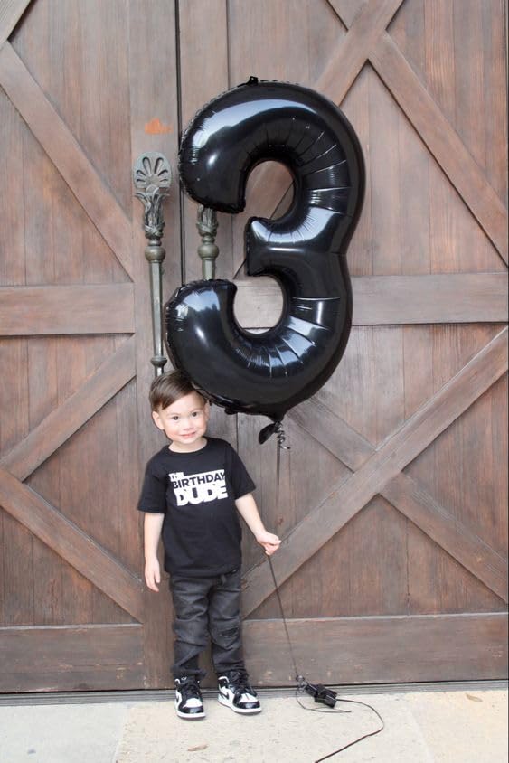 IWERP black 16 balloon used as a striking backdrop for photos.