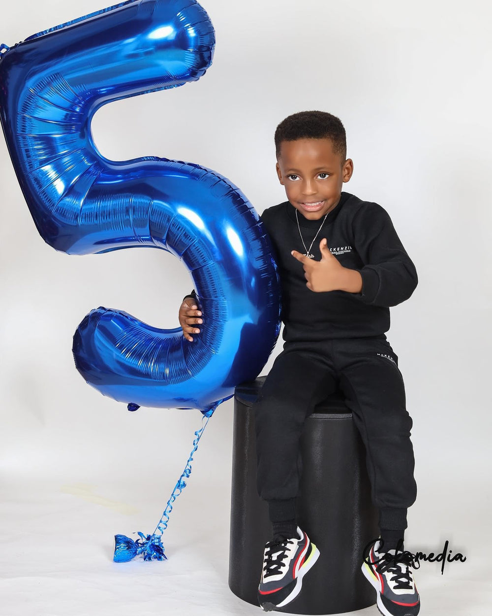 IWERP blue party decor complements themes and photo ops at anniversaries.