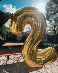 IWERP champagne gold 2-balloon backdrop elevates ambiance with luxury touches.