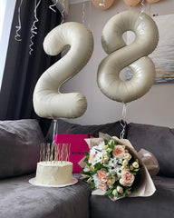 IWERP cream-8-balloon-photo-backdrop enhances memorable birthday moments.