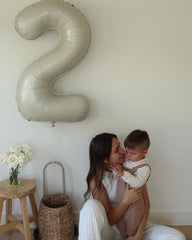IWERP Cream Number 2 Balloon 40-Inch enhances party decor as a centerpiece prop.
