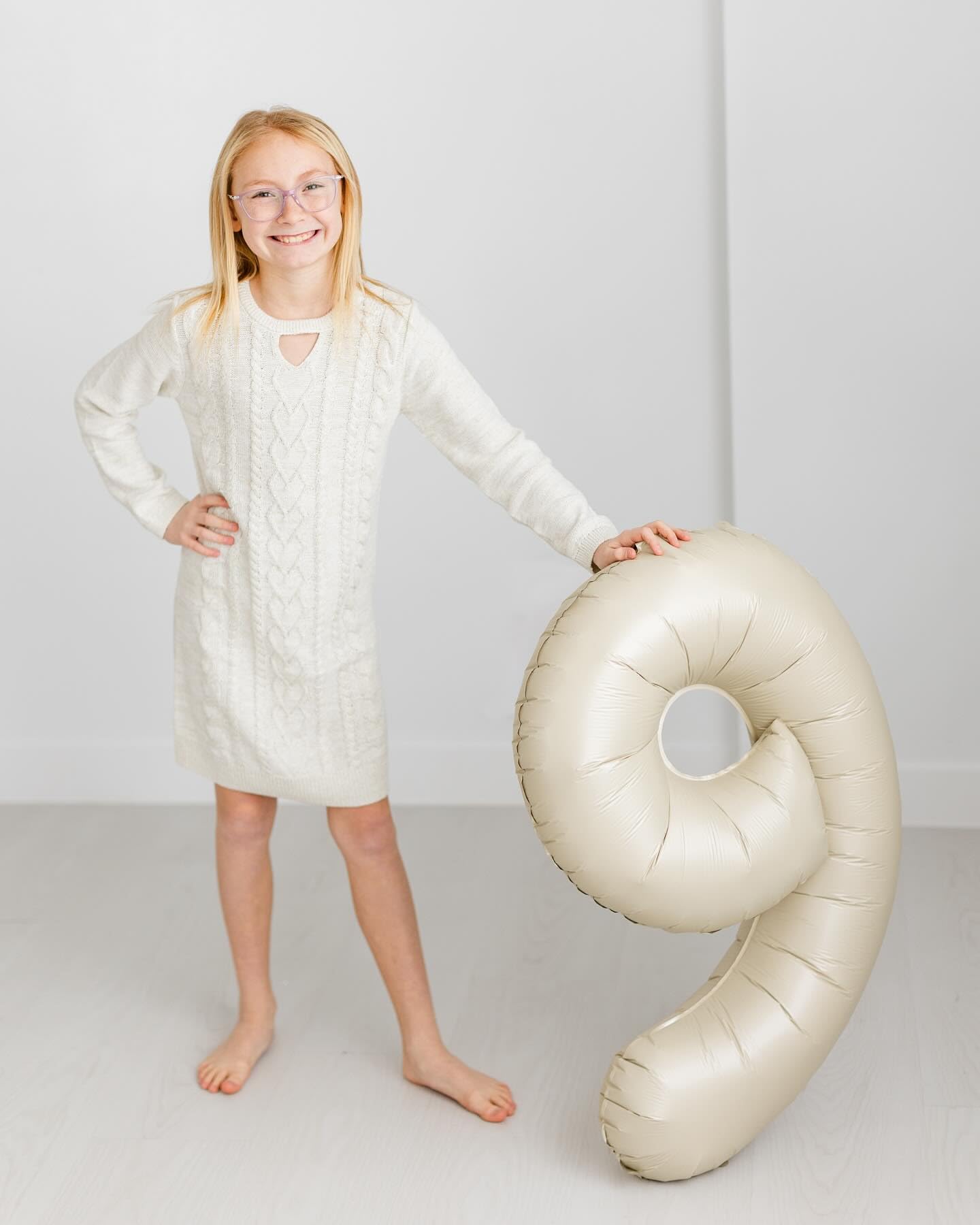IWERP Cream Number 7 balloon used as a versatile photo backdrop.