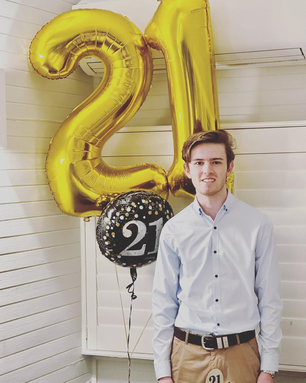 IWERP entrance decor gold 21 balloon creates inviting party focal point.