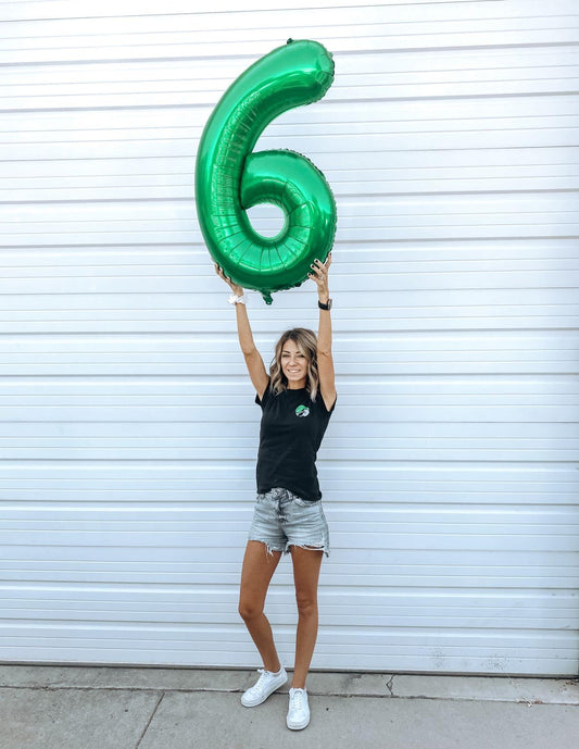IWERP Green foil 16 balloon adds a vibrant focal point.