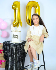 IWERP gold-10th-birthday-balloon-glossy-finish shines as a luxurious focal point.