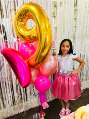 IWERP gold balloon decor enhances party ambiance and photo opportunities.