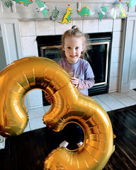 IWERP gold number-3 balloon decor adds elegance and celebration.