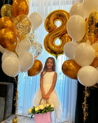 IWERP gold number 8 balloon decor at entrance and stage for photo moments.