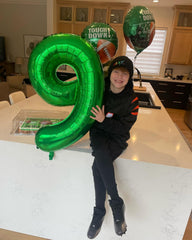 IWERP Green birthday decor highlights the theme with vibrant color and shine.