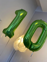 IWERP green number 10 birthday decor balloon enhances centerpiece and stage visuals.
