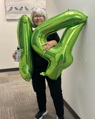 IWERP light green number balloon photo backdrop for memorable family moments.