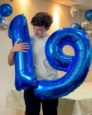 IWERP navy blue 4-balloon, 40-inch birthday decor focal point.