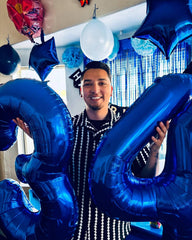 IWERP night-blue foil balloon creates luxe ambiance and shimmering centerpiece.