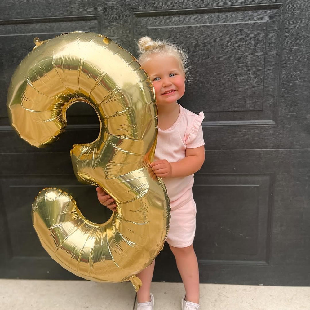 IWERP foil 3 balloon in champagne gold adds elegant milestone flair.