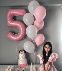 IWERP pearlescent pink 4th birthday balloon complements other colors and themes.