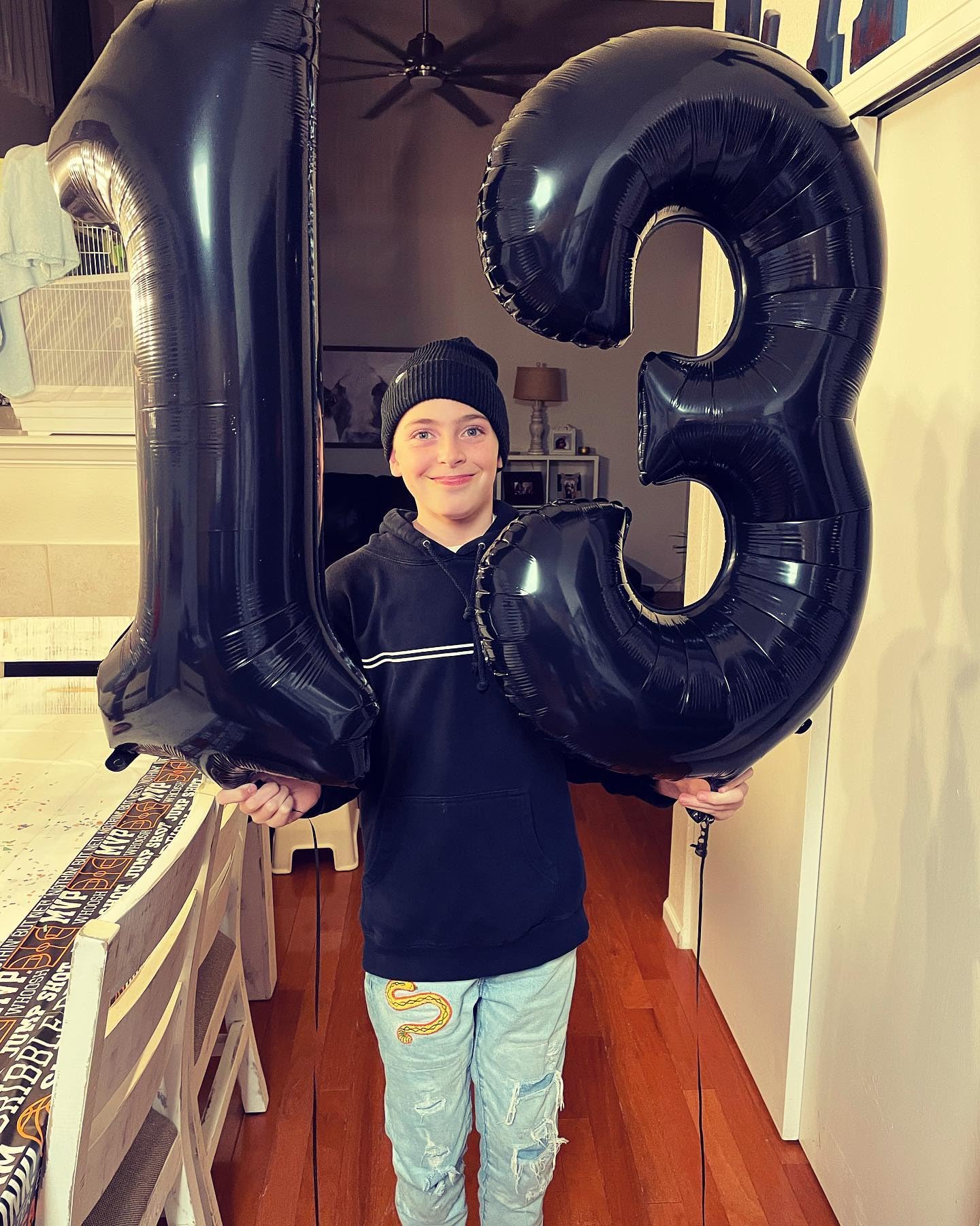 IWERP photo backdrop featuring black 13 balloon for celebrations.