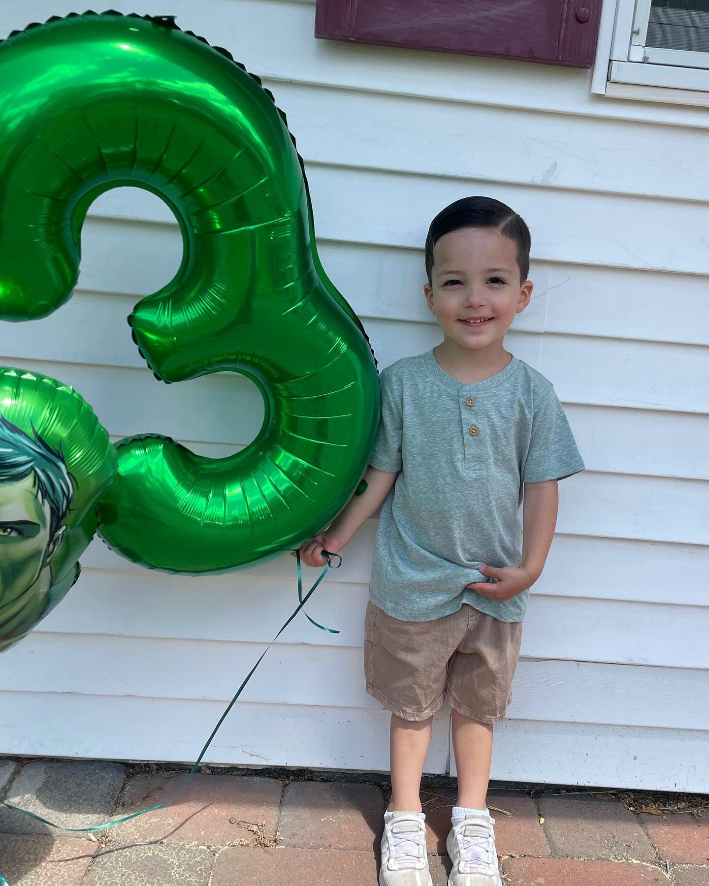 IWERP Green balloon creates a vibrant photo backdrop.