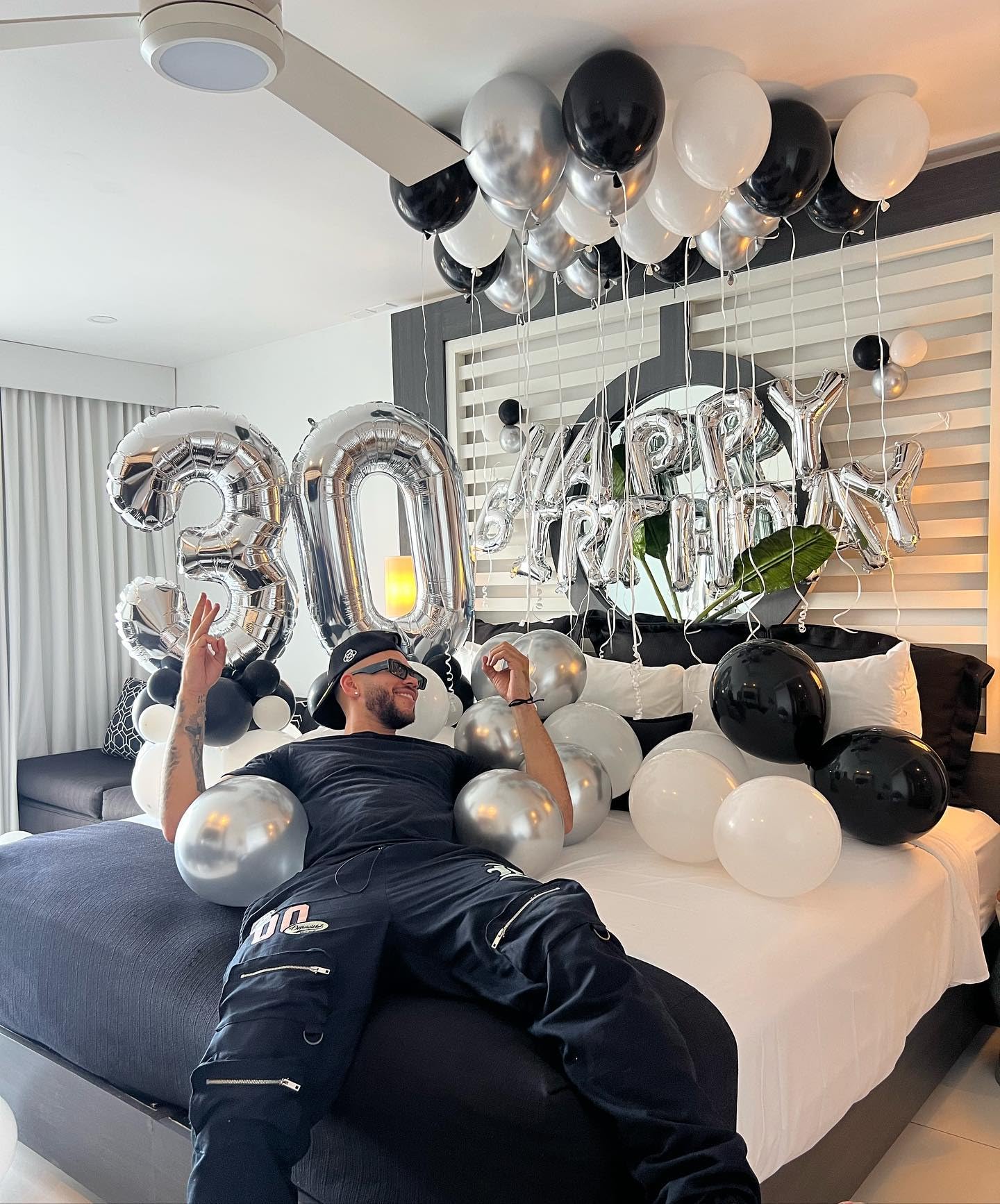 IWERP photo backdrop features silver 50th balloon for memorable portraits.
