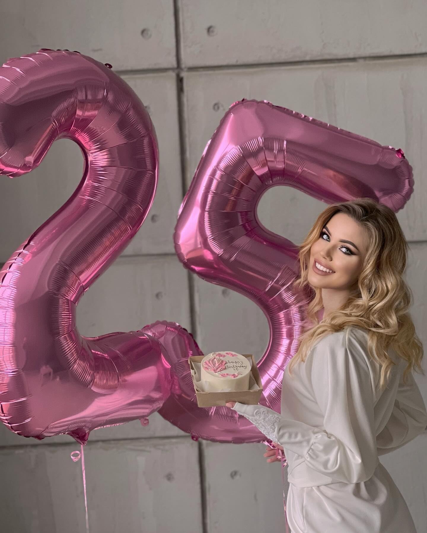 IWERP pink 4th birthday balloon stage setup adds vibrant color