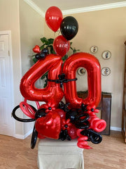 IWERP Red 9 balloon backdrop for red-themed parties and photos.