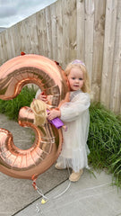 IWERP rose gold 40-inch birthday balloon adds a dramatic backdrop.