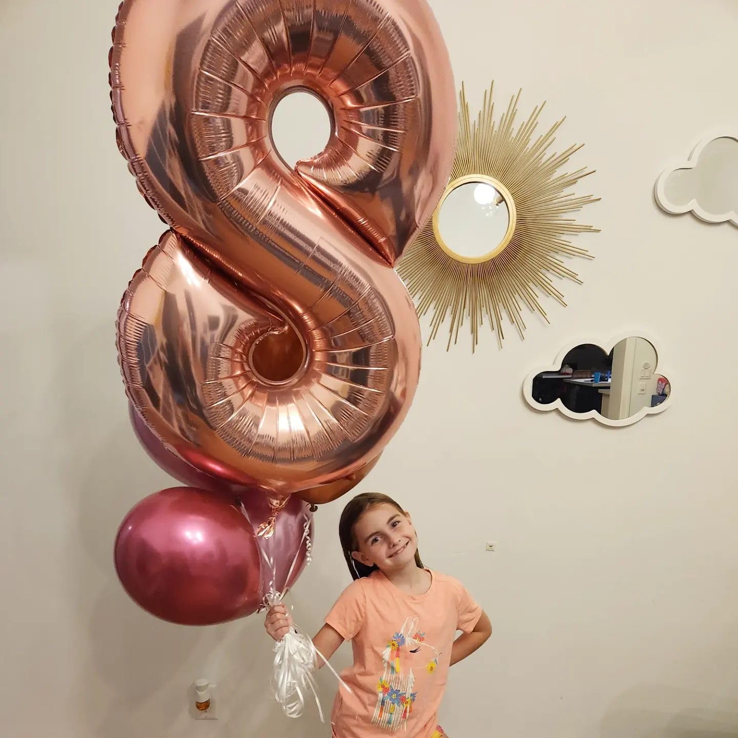 IWERP rose gold 8th birthday balloon creates a chic backdrop for celebrations.